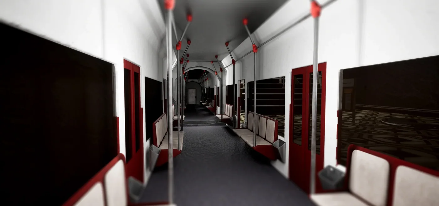 Interior de un vagon de la estacion de metro, con asientos rojos y crema, barras metalicas y suelo con motivos geometricos